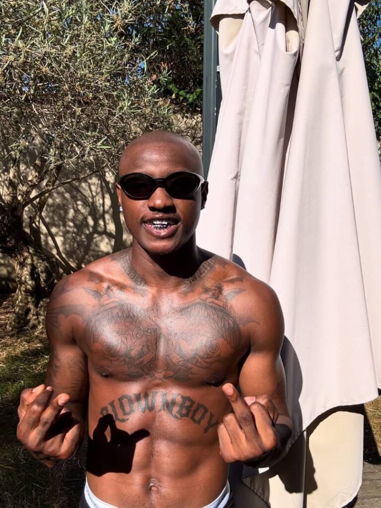 Ruger Shocks Fans With Bald Head and Neck Tatts in Paris Vibes overload